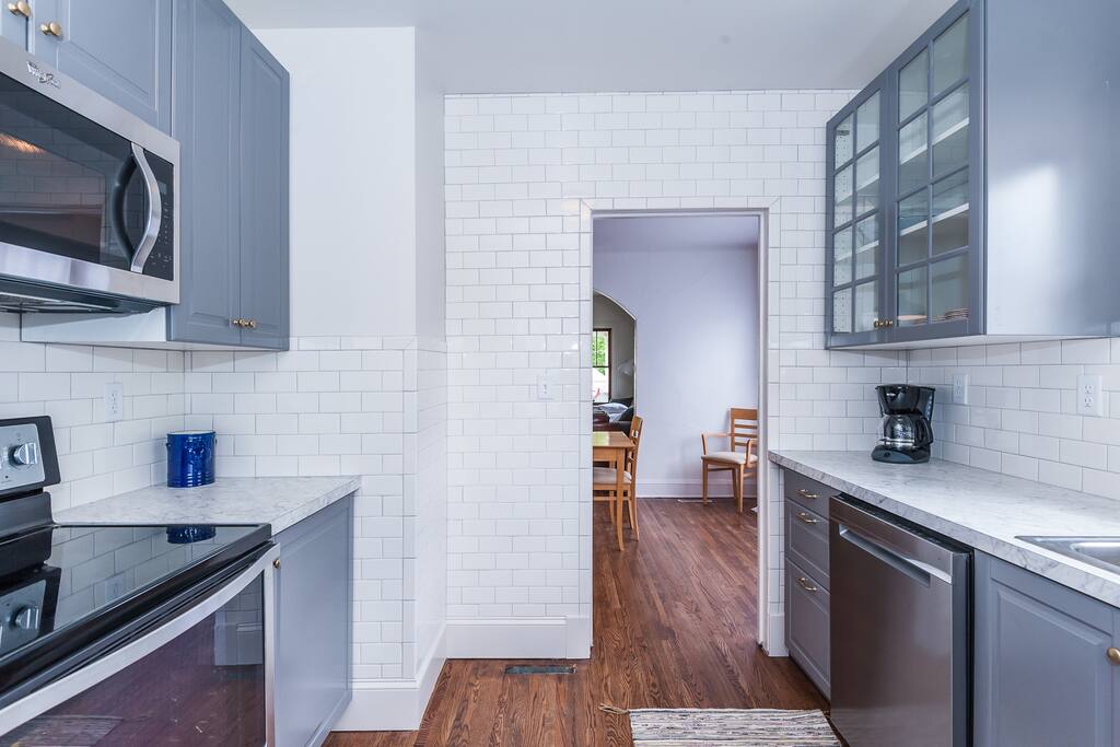 Main floor: Kitchen is stocked with pots and pans, baking sheets, tupperware, and more!