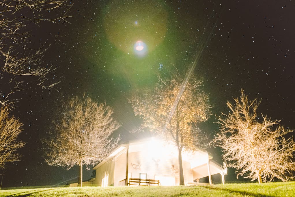 View of the lodge lit up at night.