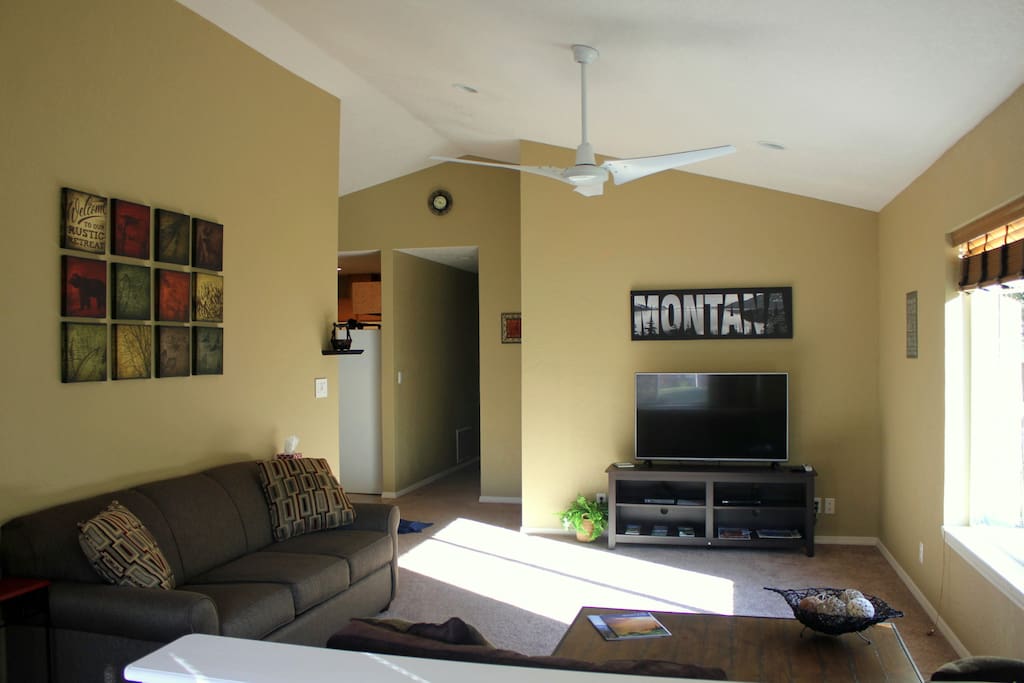 Spacious living room with vaulted ceilings.