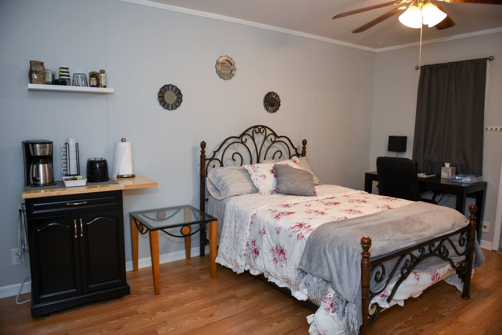 Microwave, toaster, coffee pot in room