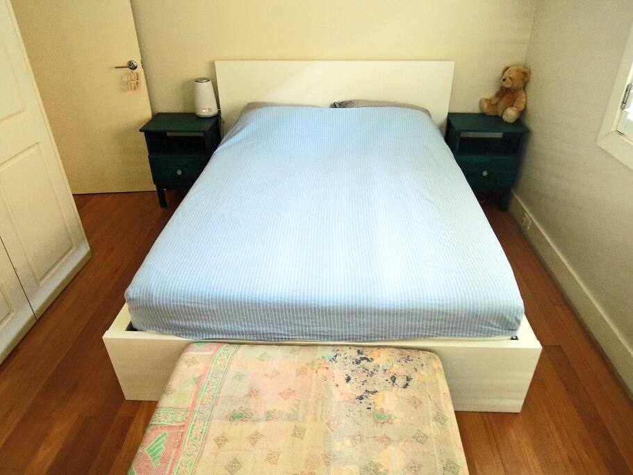 Bedroom 1: Queen size bed with high-grade mattress