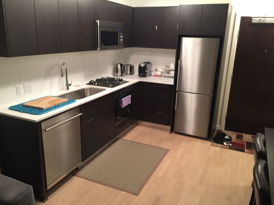 Dish soap and cleaning supplies under the sink.
