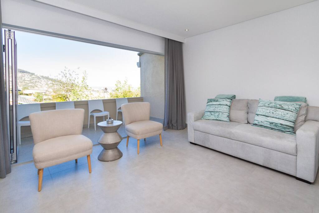 Spacious lounge opens up onto balcony with views of Lion's Head.