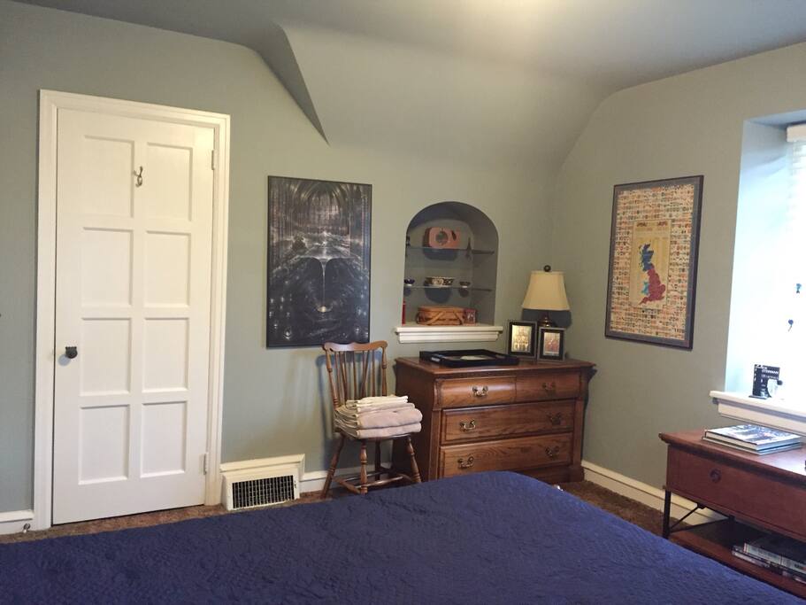 The room looks over the front and the side yard.