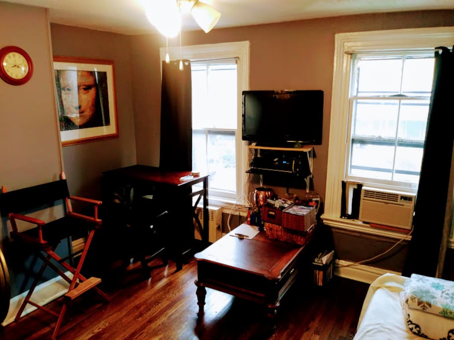 Lots of light comes through these windows during the day, and there's a nice view of a residential street outside.