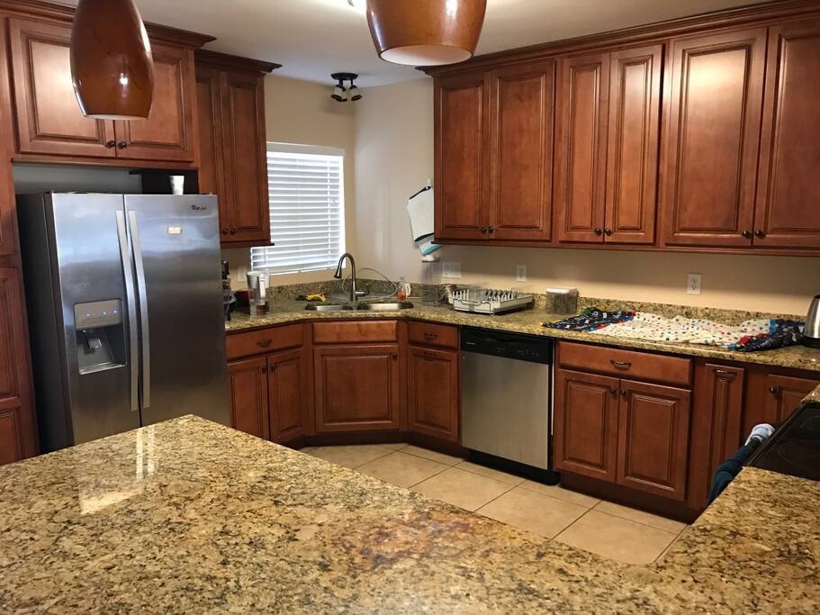 Full kitchen with fridge and dishwasher