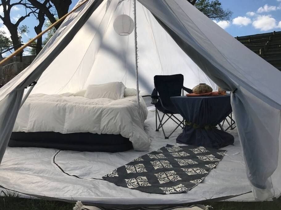 A typical setup inside of our bell tents. Parties of 2+ will have an additional queen bed.