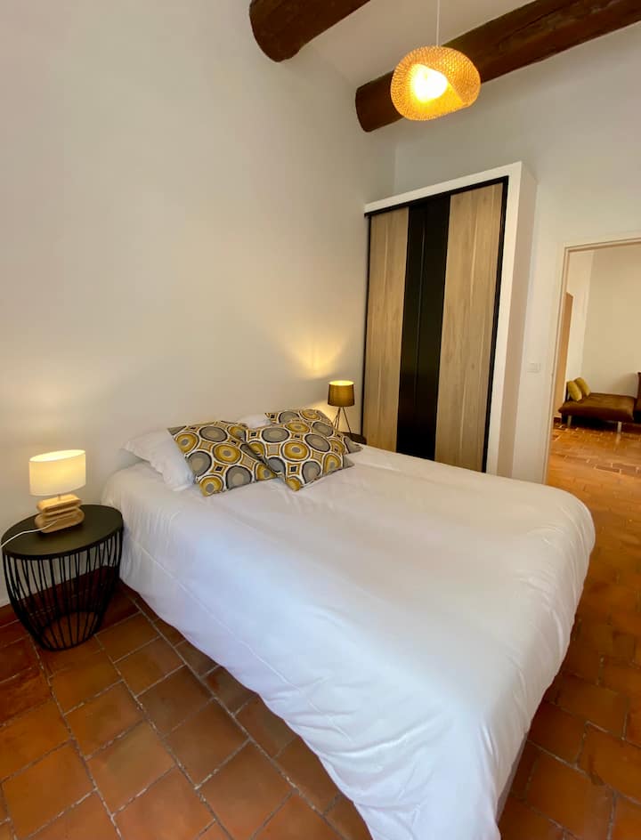 First bedroom with queen sized bed and dressing room