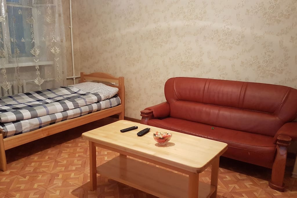 living room with another single bed confy sofa