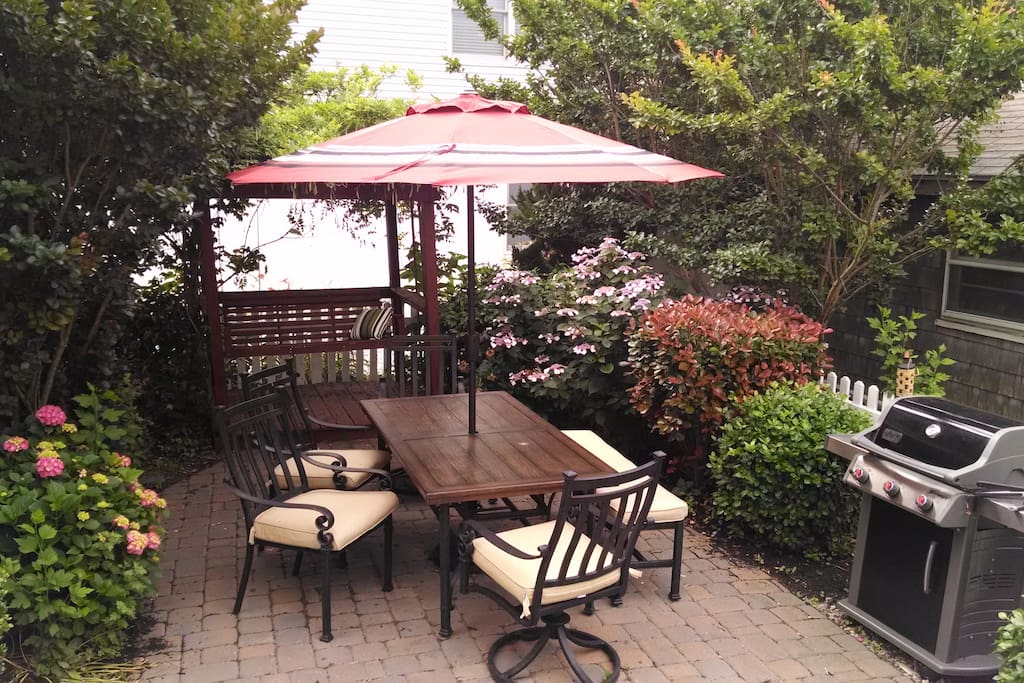 Several outdoor areas, including this grill &chill spot