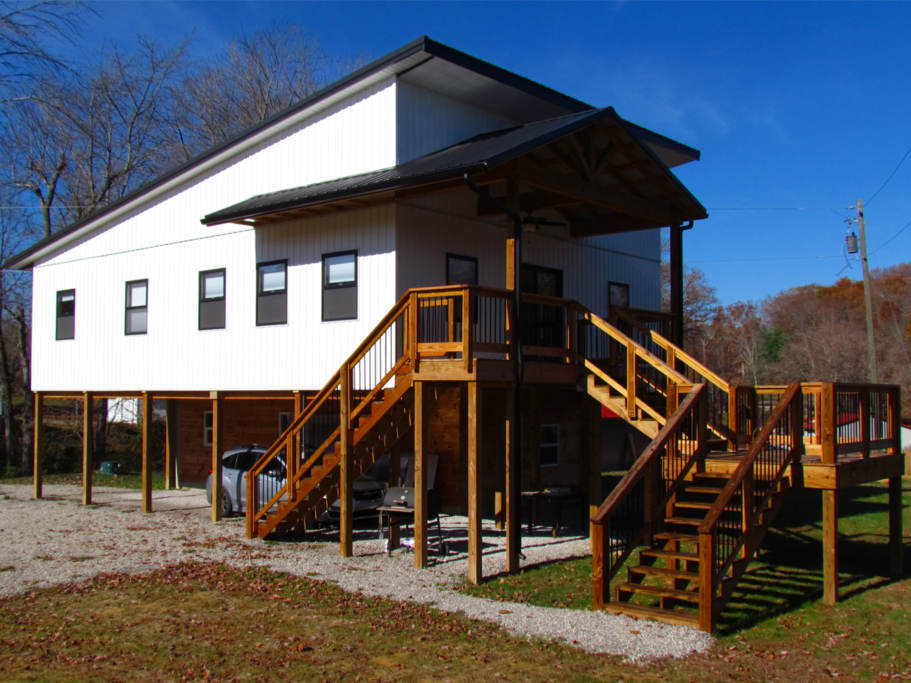 Elevated single floor house with covered parking.