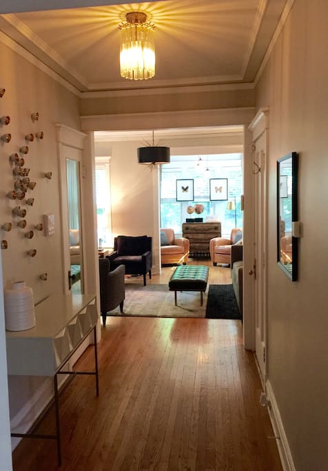 This is a look from the entry / foyer into the living room & front sunroom. We finished the unit with no detail ignored or forgotten to provide a home away from home experience . Read all of our reviews and you will see what I'm talking about ... We do it all for you and your guests .