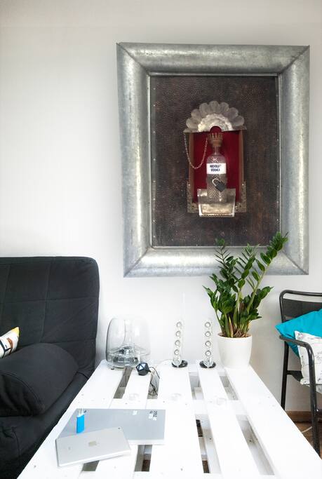 Bluetooth spekers and sofa. Interesting artwork on the wall ;).