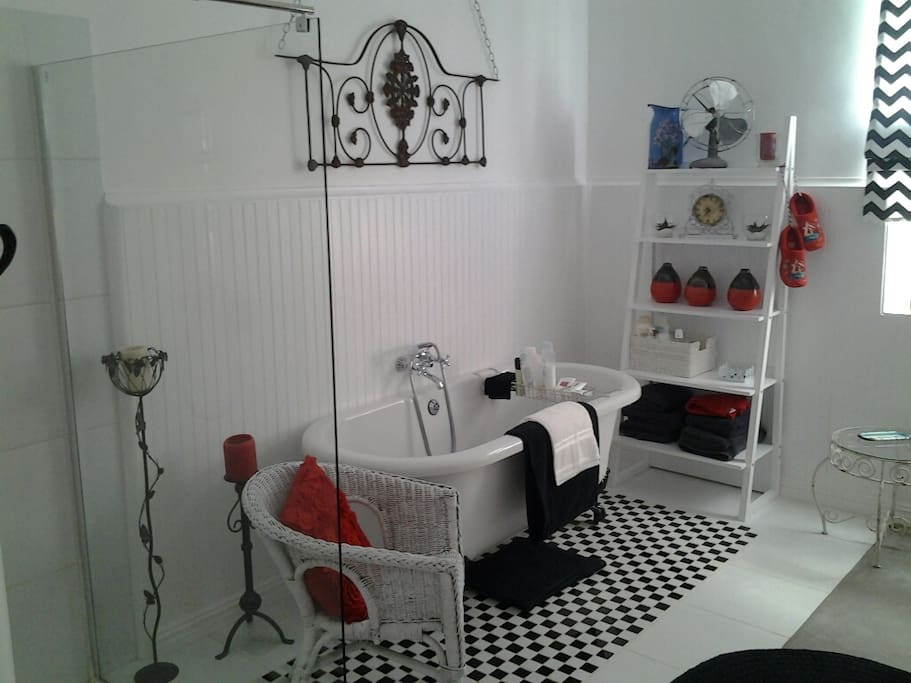 Bathroom with bath and walk in shower, double basin and toilet