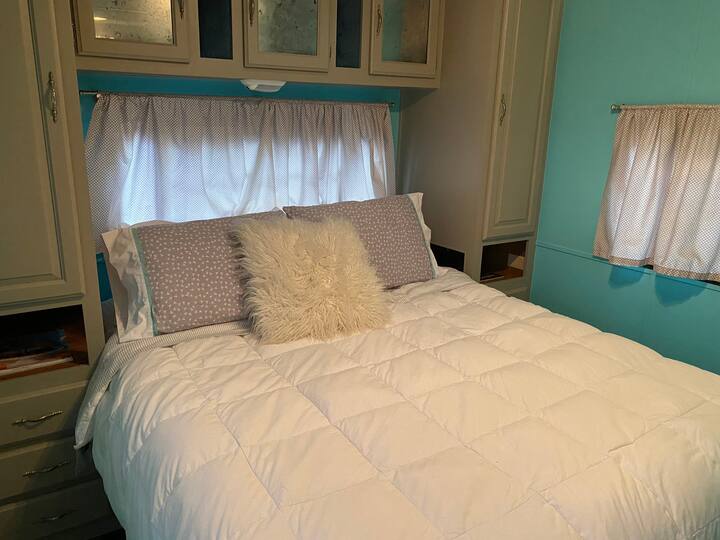 Guests LOVE our cozy Queen sized bed -- it's super comfy! We've got extra sheets and blankets in the bathroom cabinets, too.