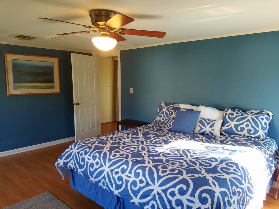 Roomy bedroom upstairs with a comfortable California king bed and closet space