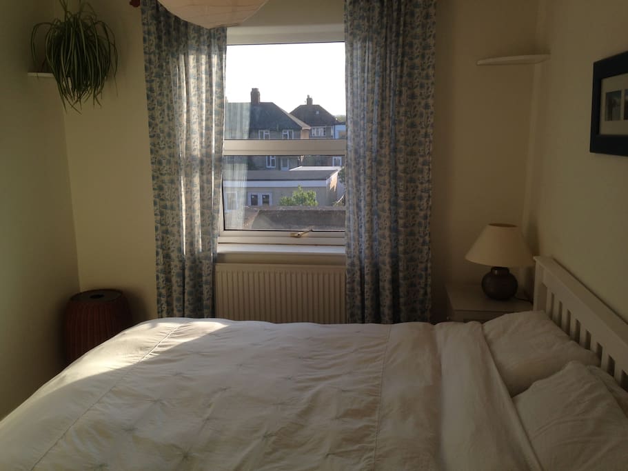 Bedroom 1 with king bed. Overlooks the garden.