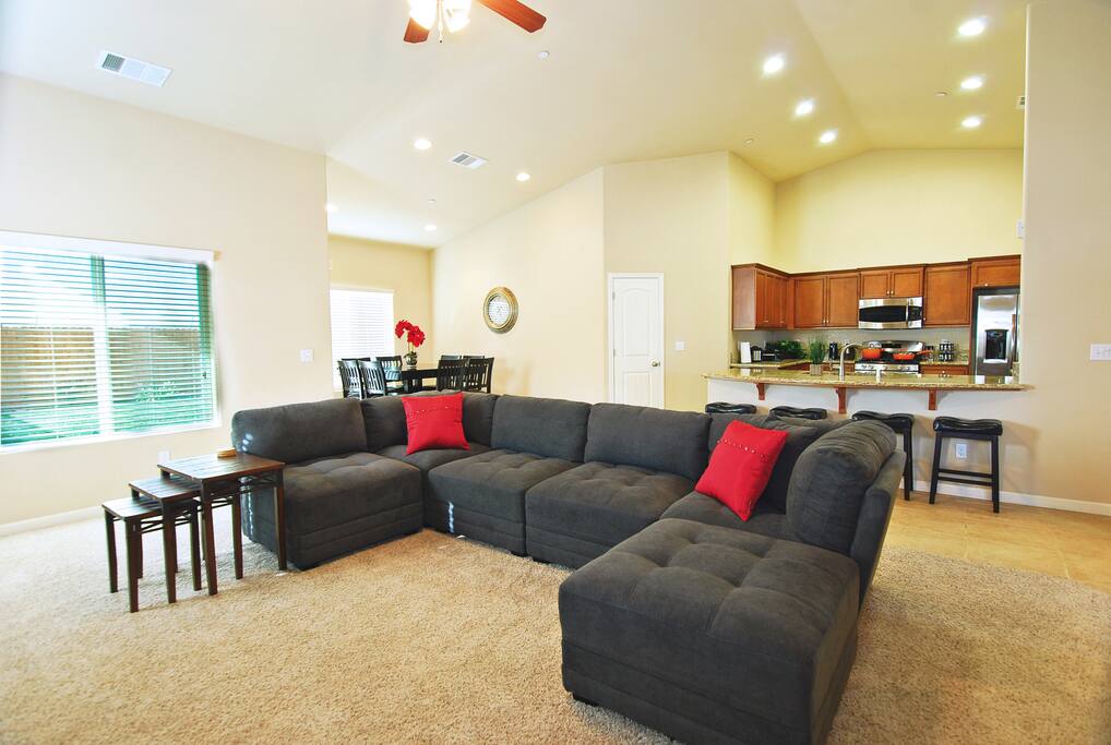 Picture yourself relaxing on this couch under the high ceiling with a glass of wine and good conversation....