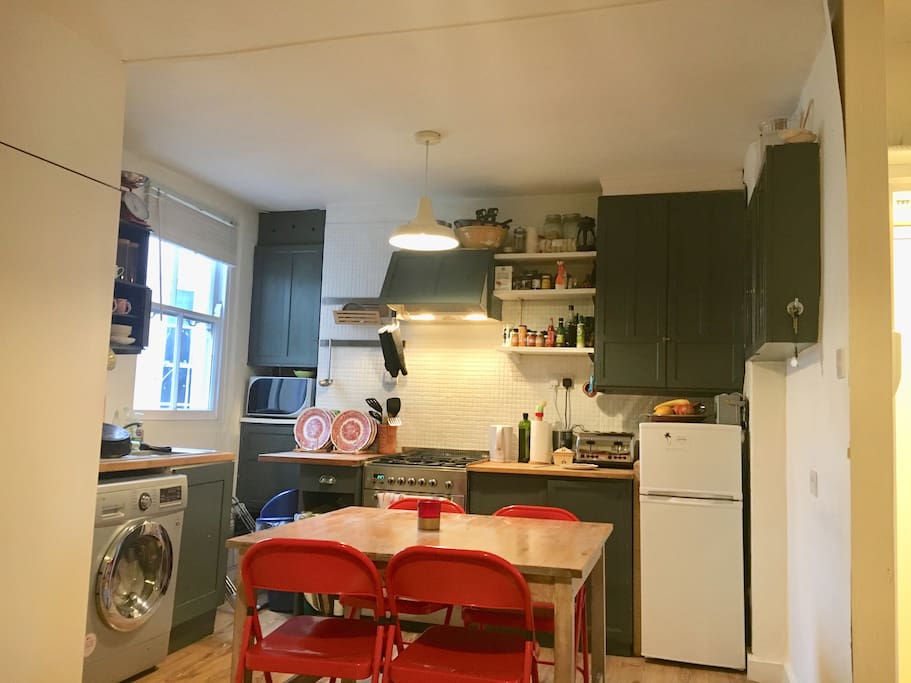 Our little kitchen, with extractor fan, oven, hobs and washer dryer!