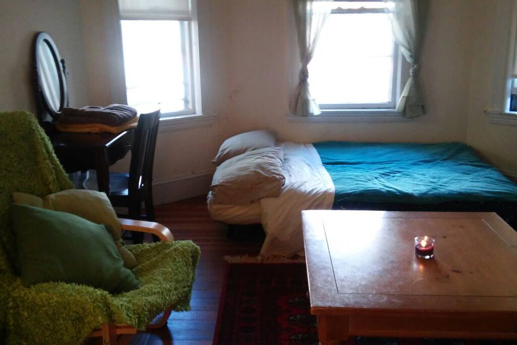 The futon pulls out to be a bed as pictured here.