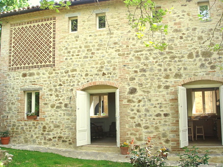 Front of the house with two sets of french windows.