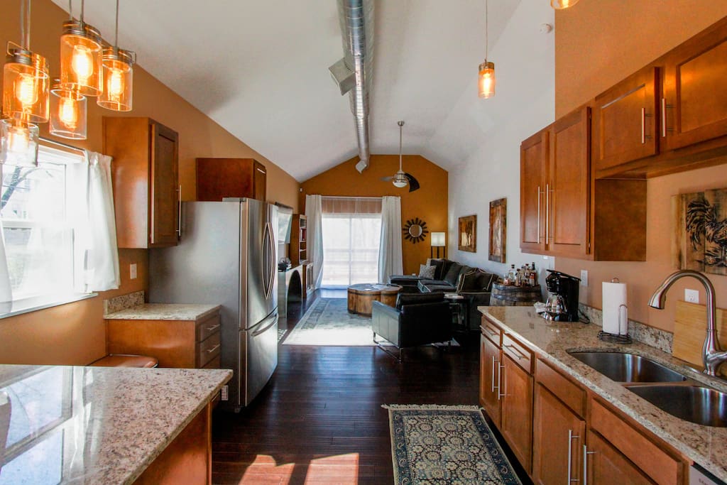 Open floor plan with all new kitchen, bamboo floors, Arhaus sectional, and 60" LG smart tv