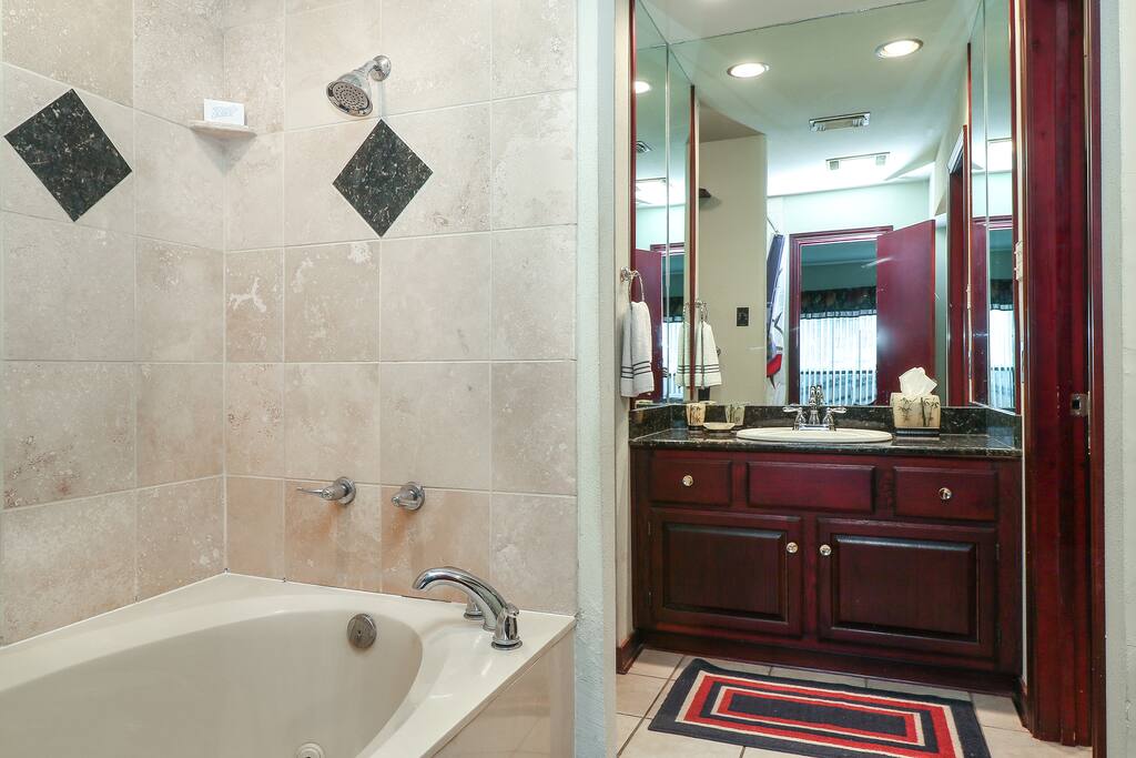 Travertine Tile Garden Tub with Jacuzzi Jets for soothing and relaxing