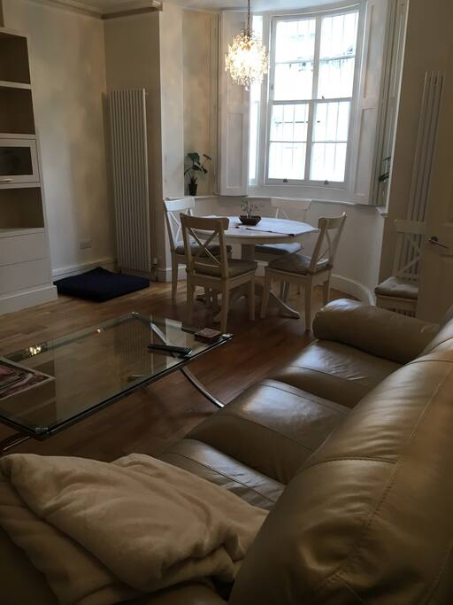 Large open plan living area with bay window