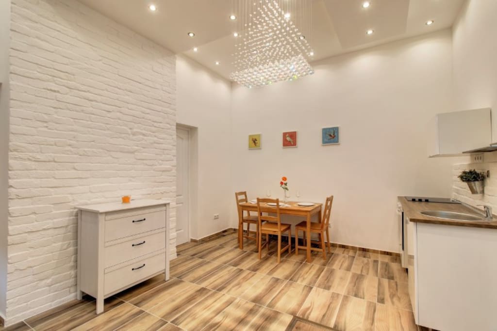 Living room, dining area, small wardrobe, door to bathroom