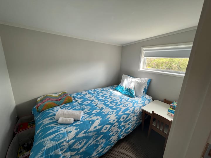 Bedroom 3 : sleeps 1
Small room with King single Bed suitable for Children/Teens this room is next to the master bedroom. 

Please Note* This room is accessible via Bedroom 2 