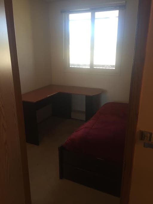 Small desk, there is a chair as well.