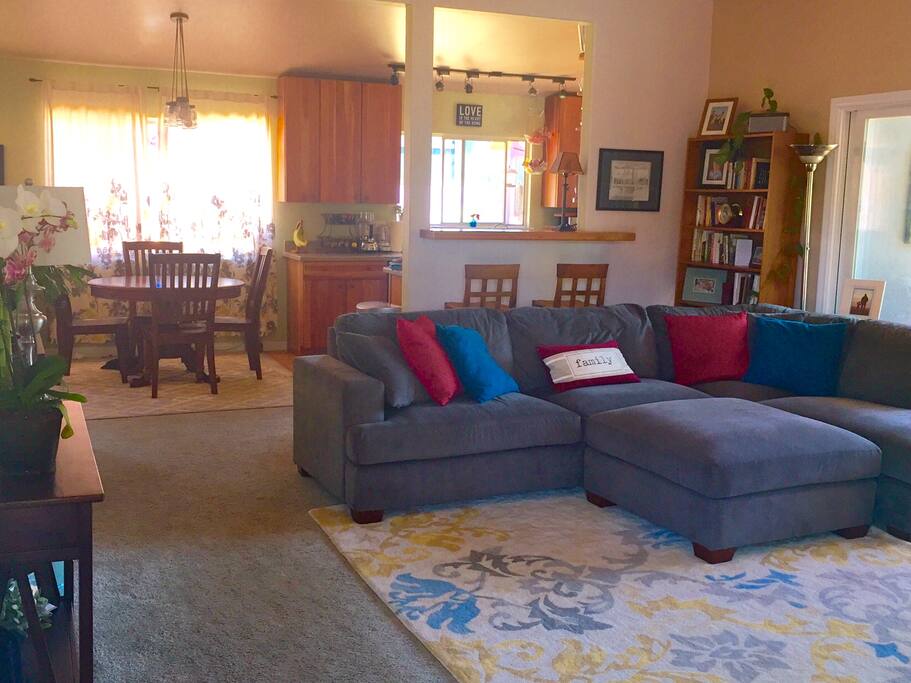 Open kitchen between the dining area, living room and windows to the back yard.