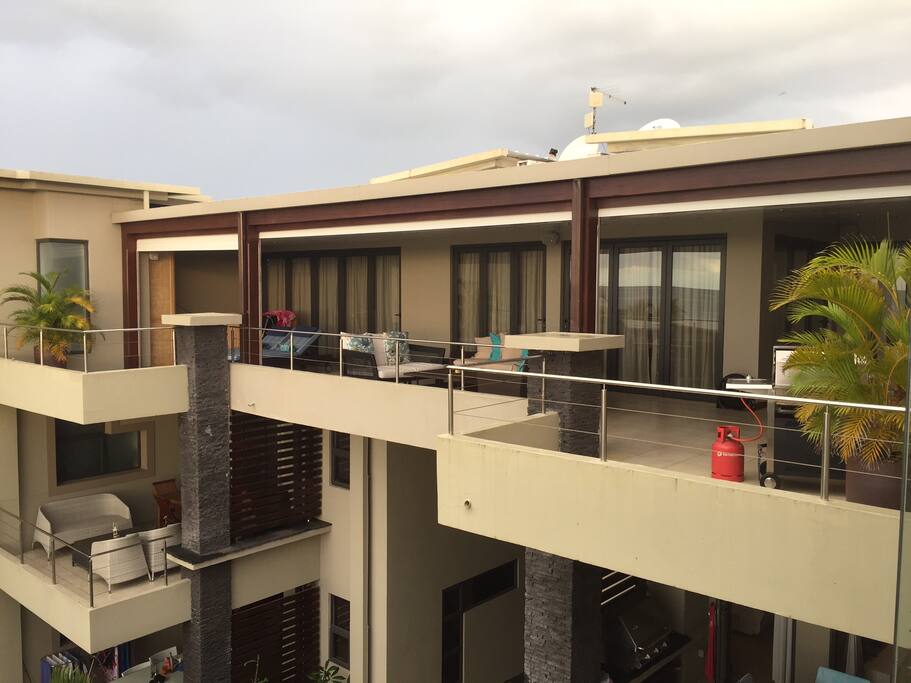 Front view of the penthouse apartment with full front electric roller shutters when required