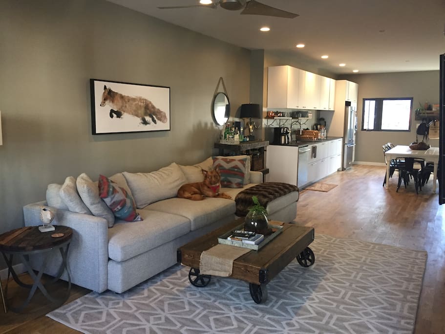 Living room with XL Crate & Barrel Lounge sofa and hand built rustic industrial furniture.