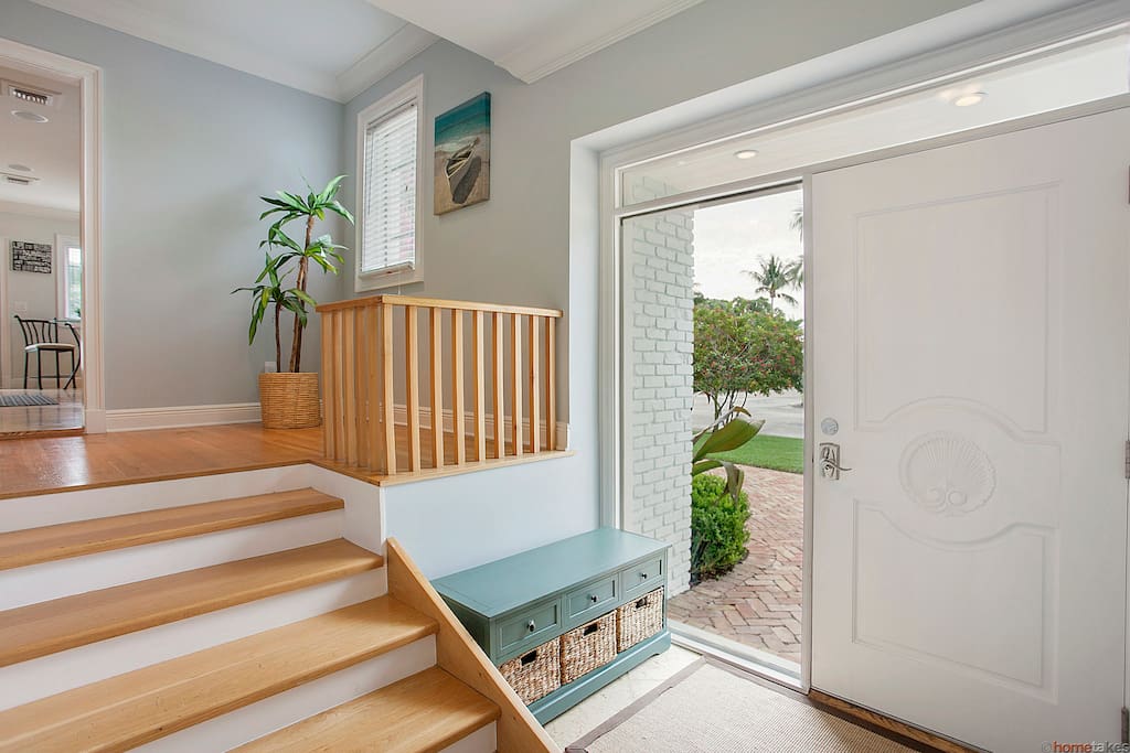 The large entrance way opens to both living upstairs and downstairs living rooms.