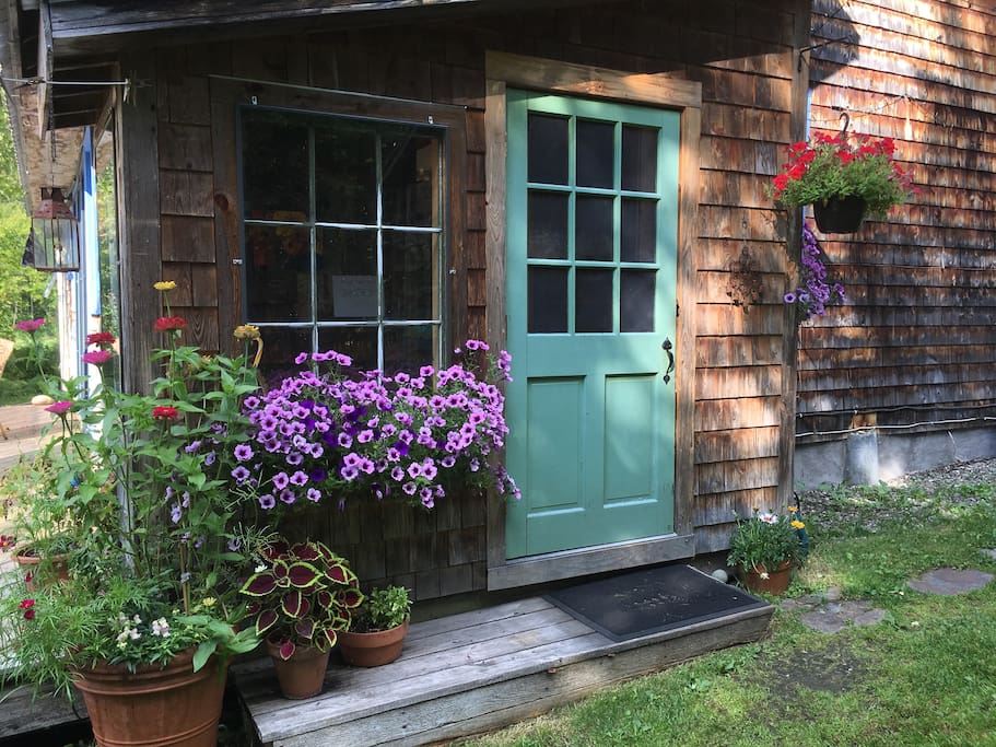 This is the door to mudroom where you can hang your towels in Summer, your sweaters in the Fall or your coats in Winter!