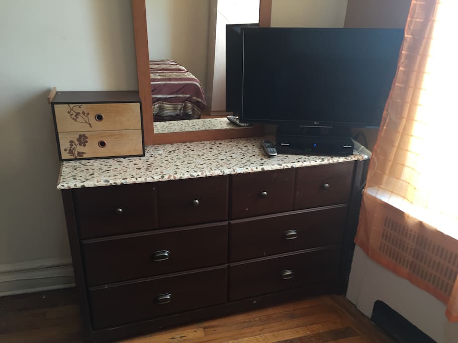 Your Room-TV with basic cable on top six draw dresser with ample space