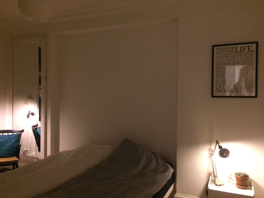 Nice bedroom with a big bed and a window to the garden