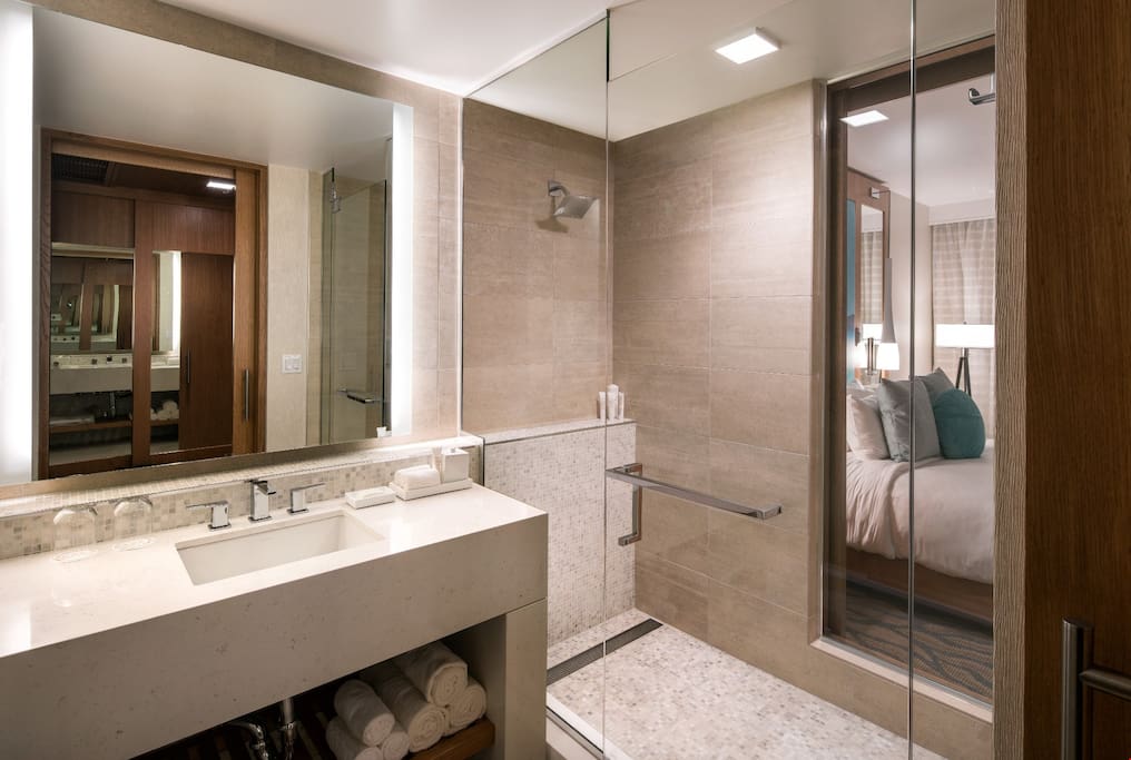 The spacious and modern bathroom features a walk-in shower