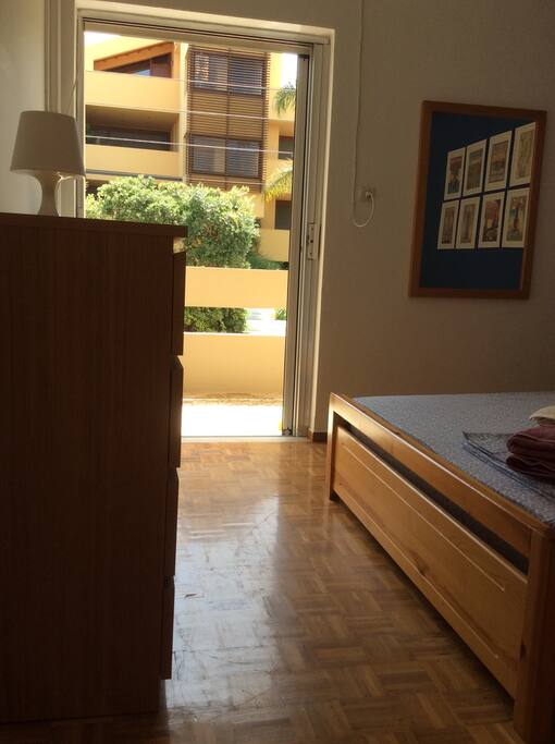 The blue room goes out to a balcony with a sitting area.