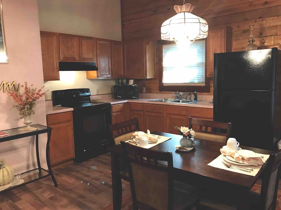 Somewhere in Time, Cabin 4 has a full kitchen and dining area