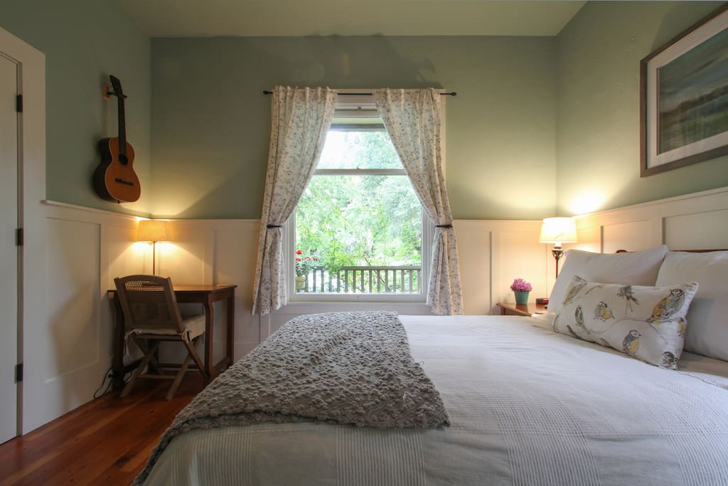 Pull back the curtains and enjoy the view of the front porch and beyond
