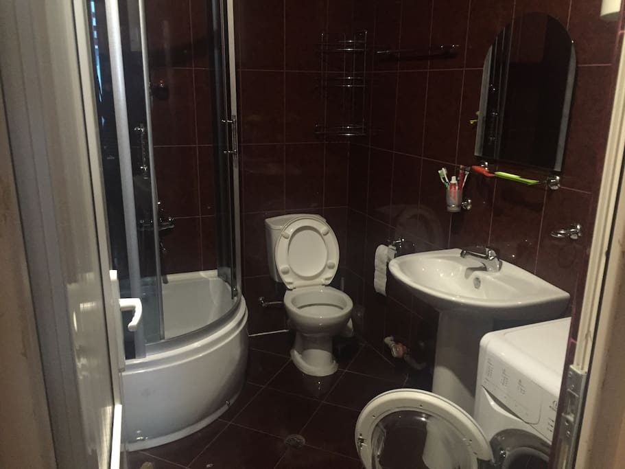Bathroom with fully operational washing machine