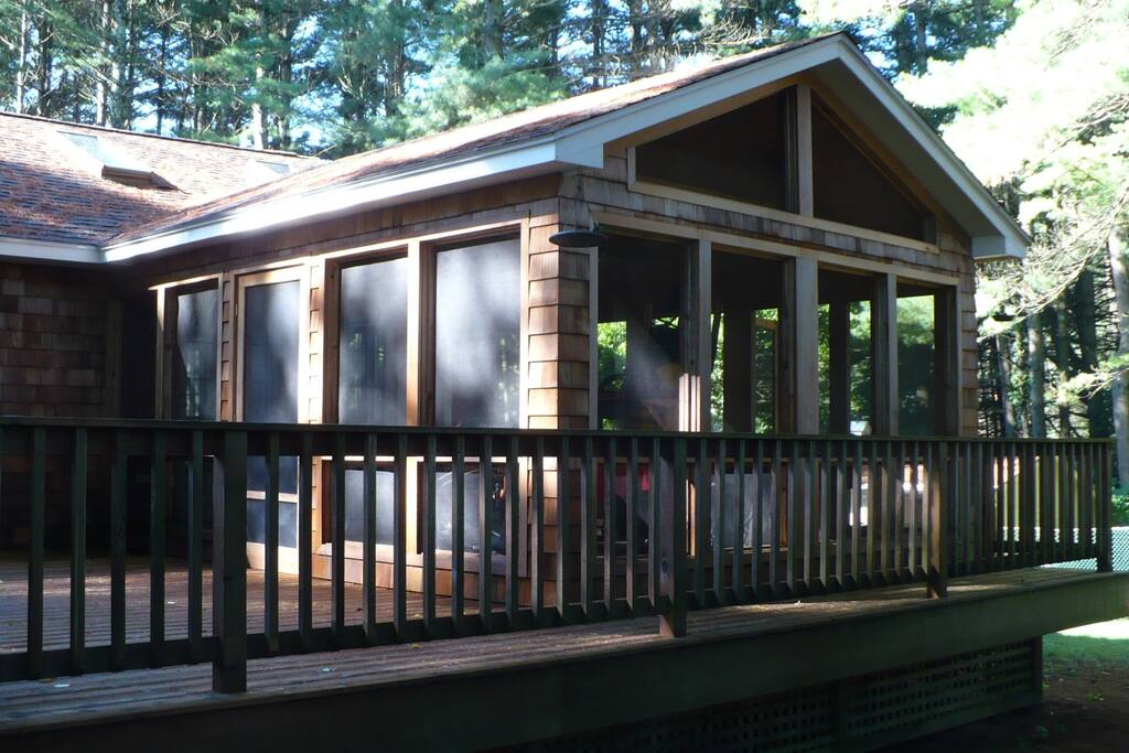 Screened in porch with dining area