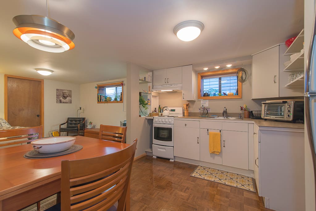 dining room table extends to seat 6, counter top convection oven to right side of photo.