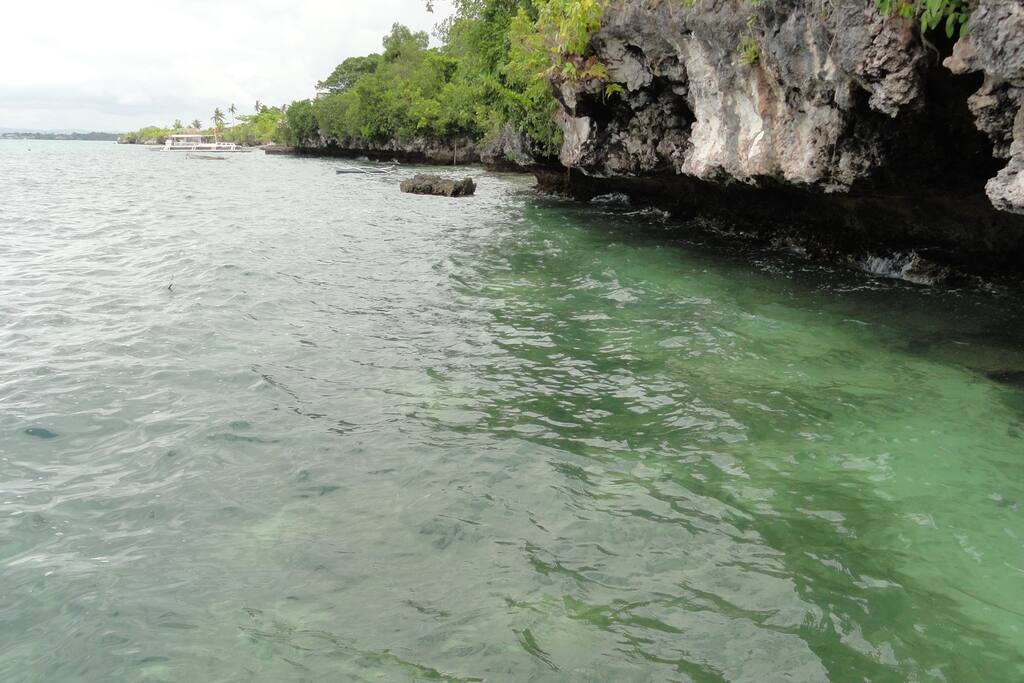 No beach below but can go swimming anytime when it's high tide. Access is thru spiral staircase.