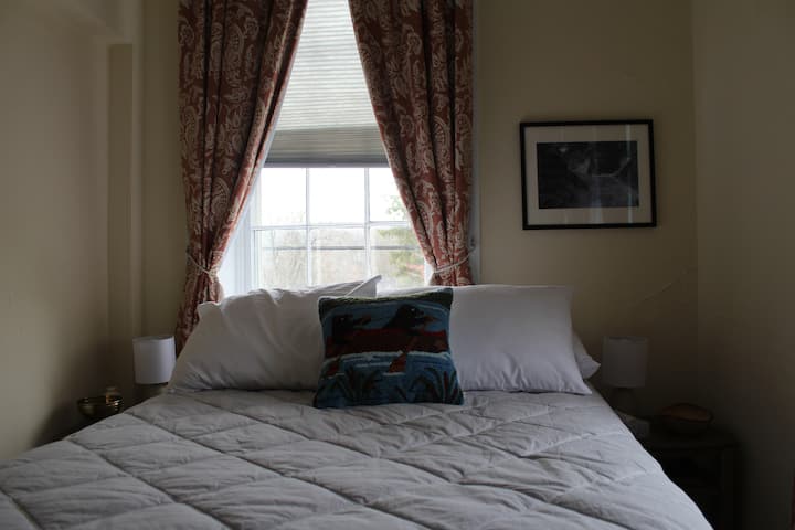 Private bedroom with Heavenly mattress on a full-sized bed. A new queen-sized pull-out couch is also available in the living room.