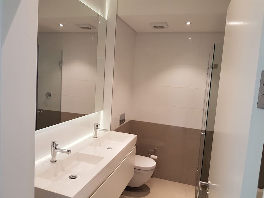 En-suite main bathroom with bath and shower