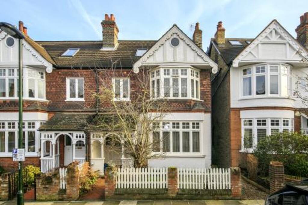 Front view of house (the circular window at the top is one of the loft room windows!)
