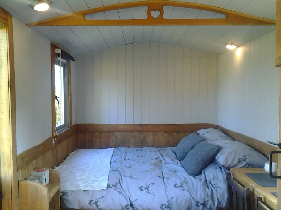 Comfy bed with plush bedding and pillows